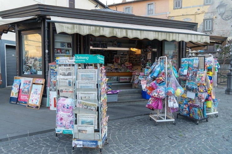 From Campsites to Pop-up Stores — One Capsule, Endless Possibilitiessunlit-tec An outdoor newsstand with various newspapers, magazines, and colorful goods on display